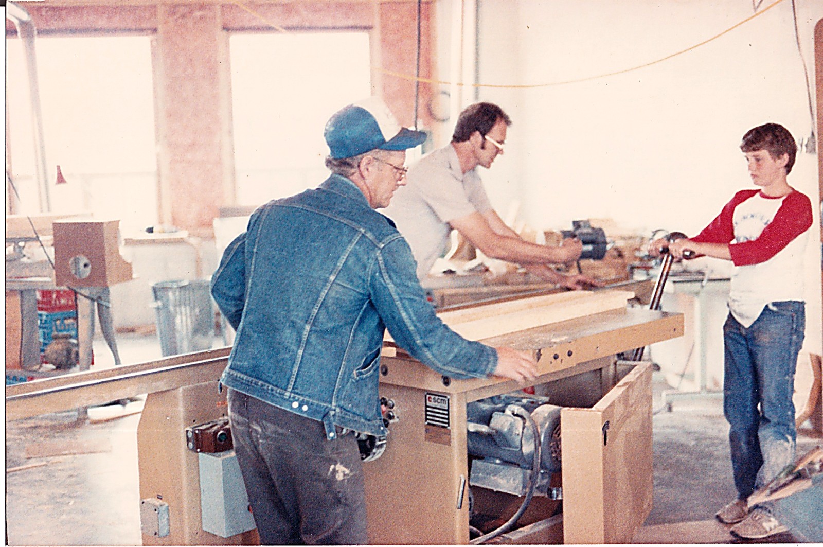 Three generations of the family milling lumber together in the shop, 1987